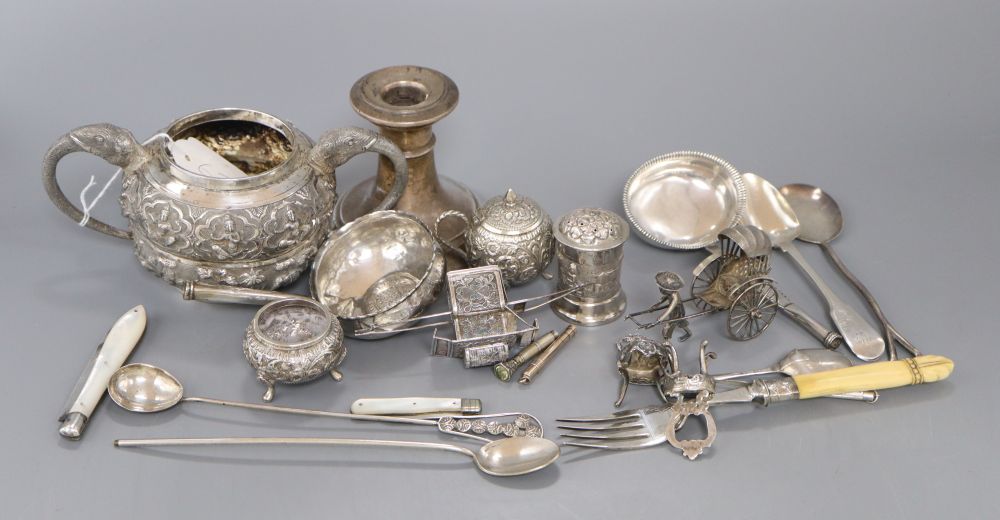 Assorted silver and white metal items including and Indian sugar bowl, dwarf candlestick, fruit knives etc.